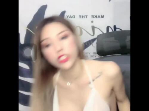 Two Asian girls show their nude body on a couch